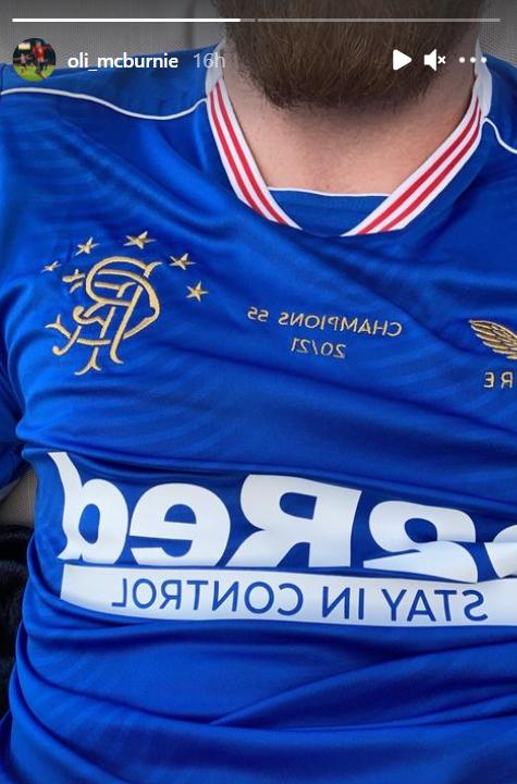 Rangers-daft Oli McBurnie wears commemorative gold Castore jersey to celebrate Premiership title win