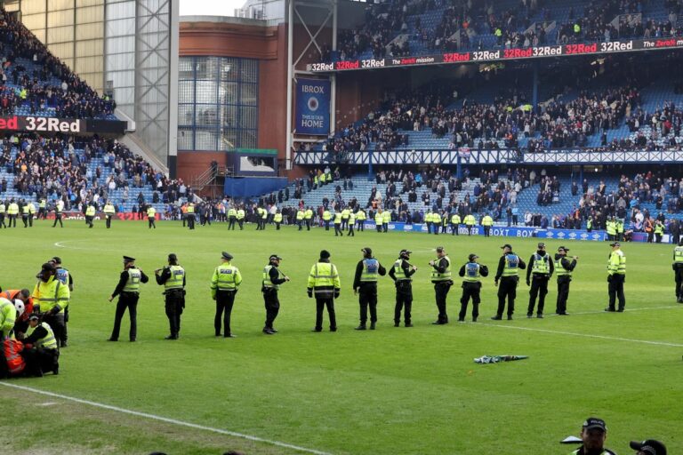 Fans clash on Ibrox pitch after Celtic knock Rangers out of cup on penalties
